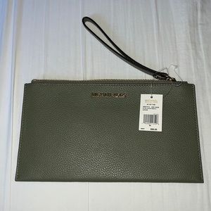 Brand New. Michael kors zip clutch wristlet.
